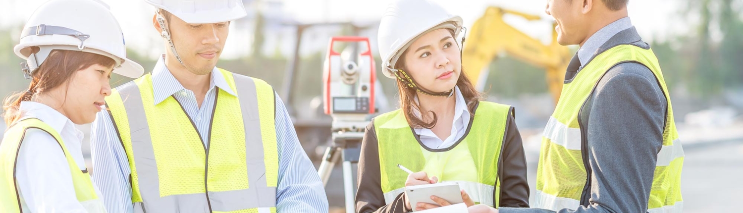 A group of construction workers having a conversation A group of construction workers having a conversation
