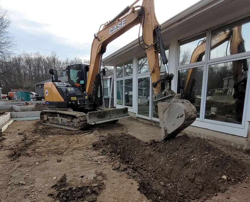 excavator being used at work site